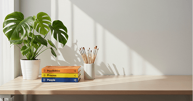 Plant and books on a sunlit desk